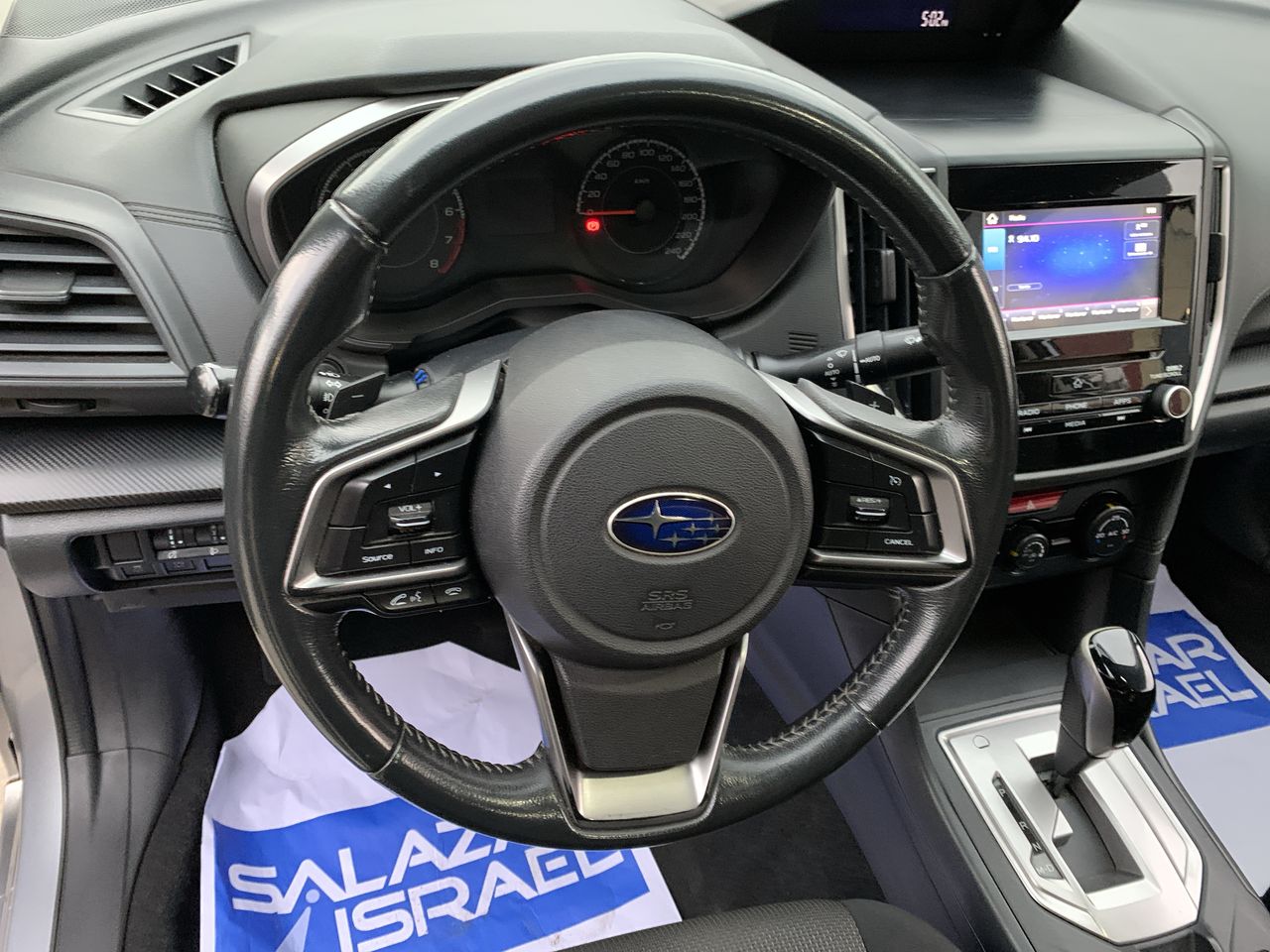 Subaru Impreza — foto 18 de 27